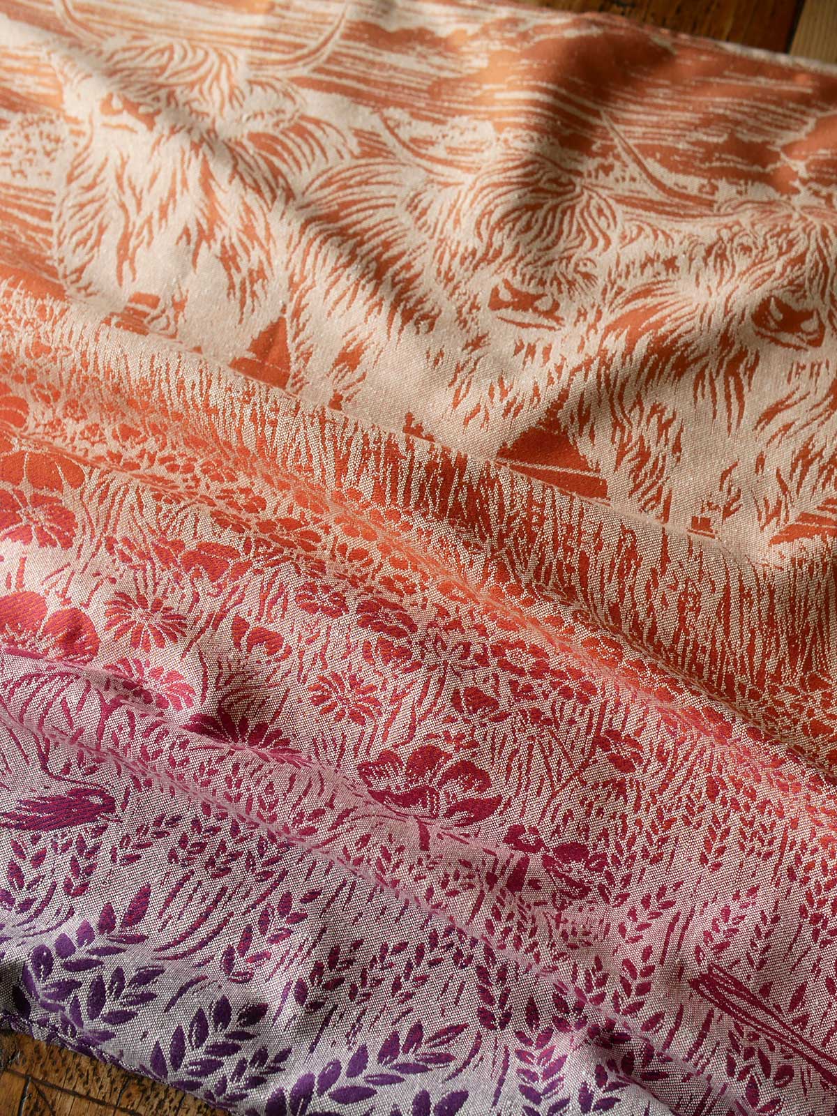 Reverse side of a colourful fabric with Highland cow pattern