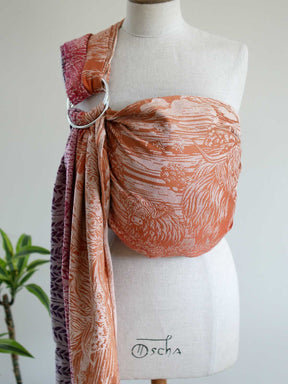 A colourful ring sling with Highland cow pattern on a mannequin