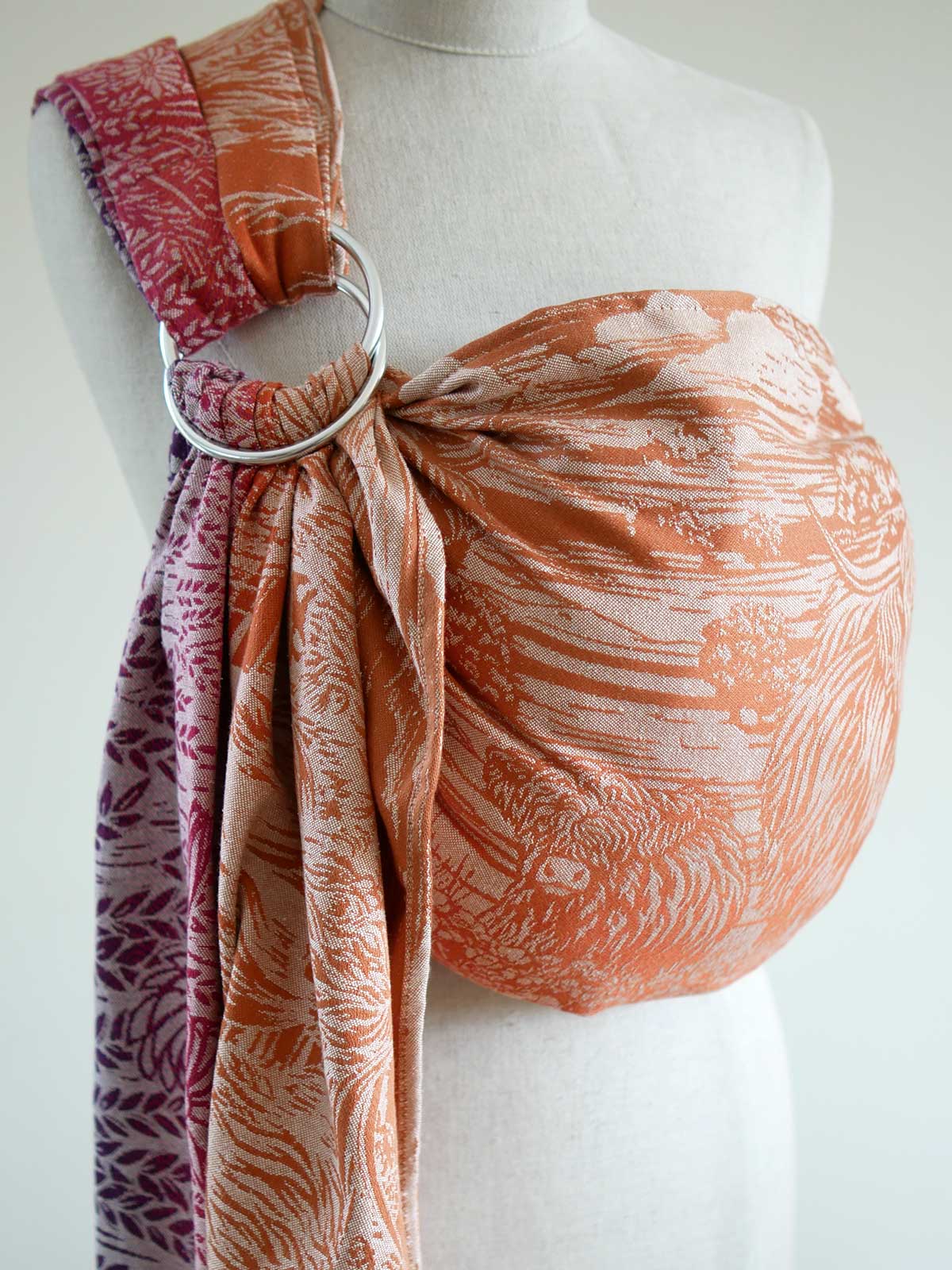 Side view of a colourful ring sling with Highland cow pattern on a mannequin