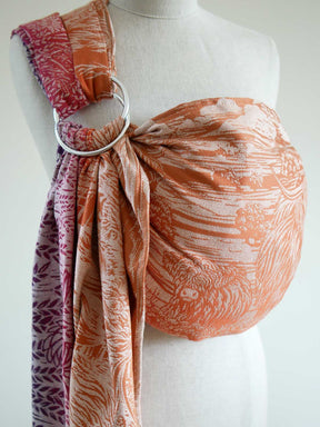 Side view of a colourful ring sling with Highland cow pattern on a mannequin