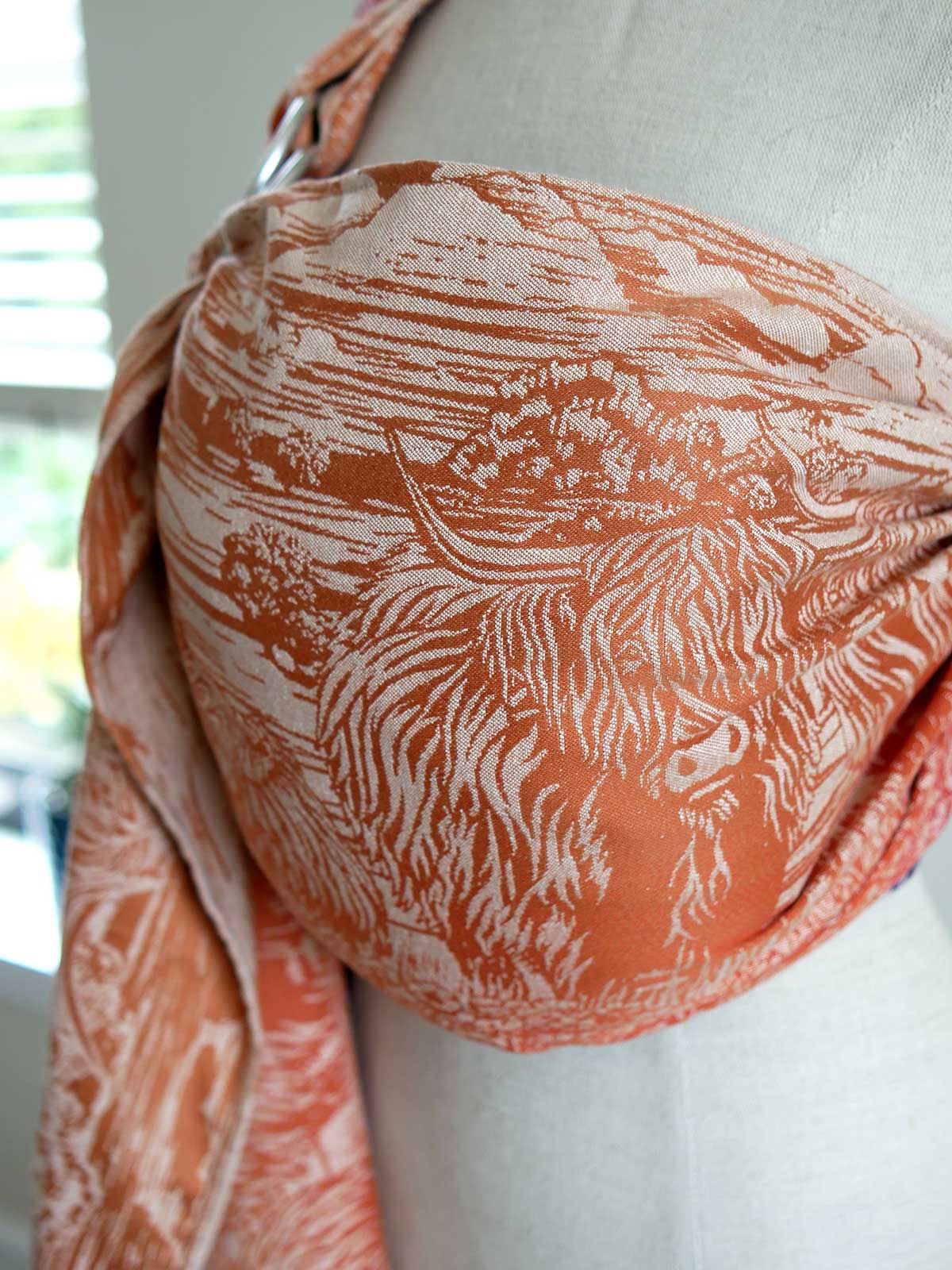 A fabric with a Highland cow pattern on a mannequin
