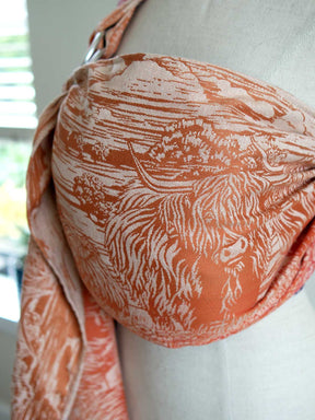 A fabric with a Highland cow pattern on a mannequin