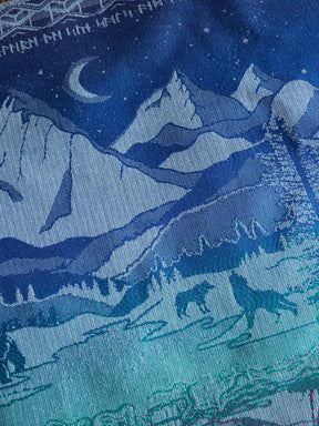 Textile with wolf and mountain pattern in blue tones