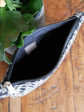 Animal print zip pouch showing dark lining. 