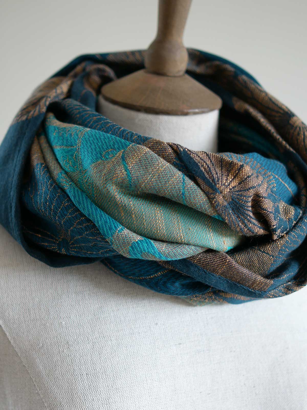Koi Moire infinity loop in teal looped twice on a mannequin