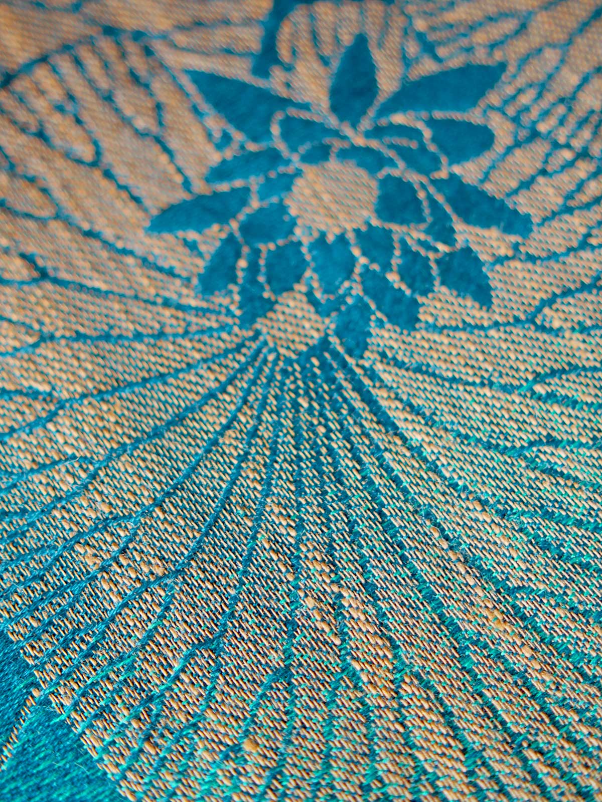 Close up of teal and gold fabric