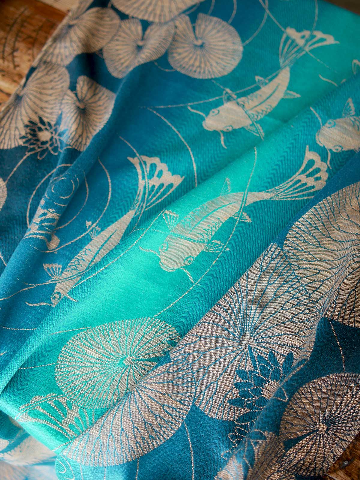 Teal scarf with fish and lily pad pattern