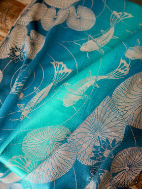 Teal scarf with fish and lily pad pattern