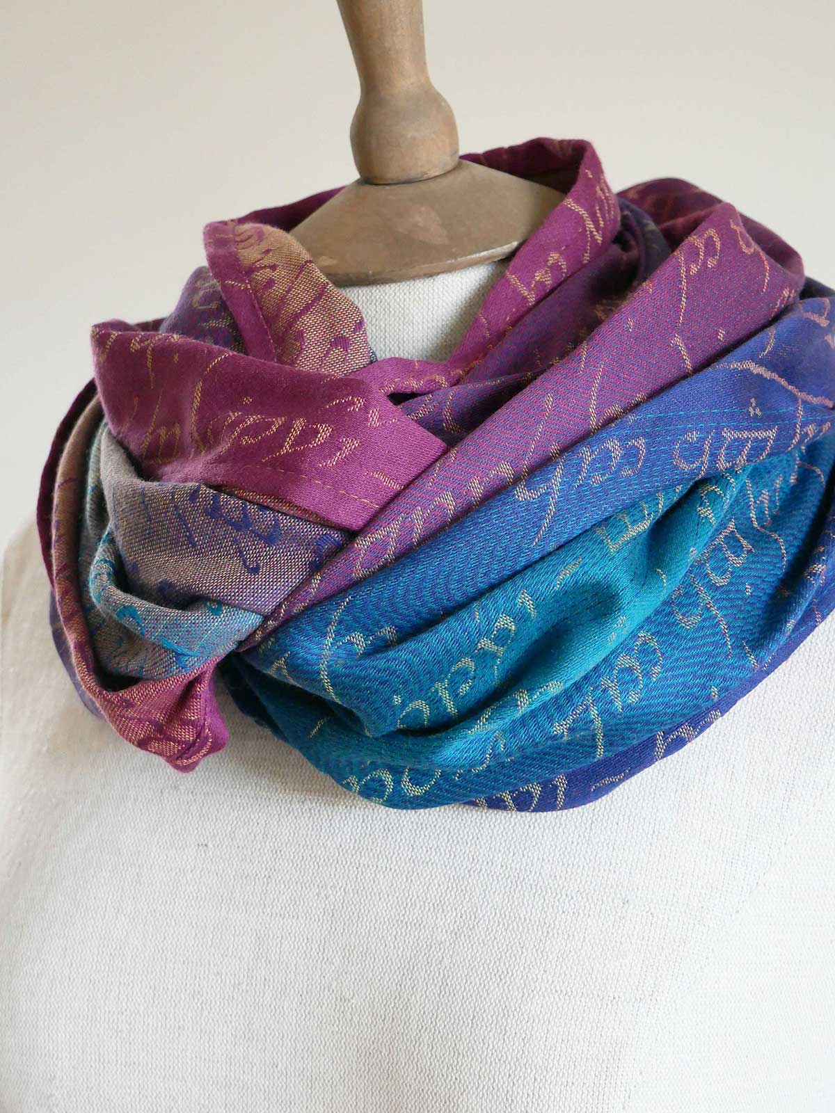 Colorful Legend of Frodo Dreme Infinity Loop with text pattern on a mannequin against a white background