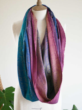Multicolored scarf on a mannequin against a white background
