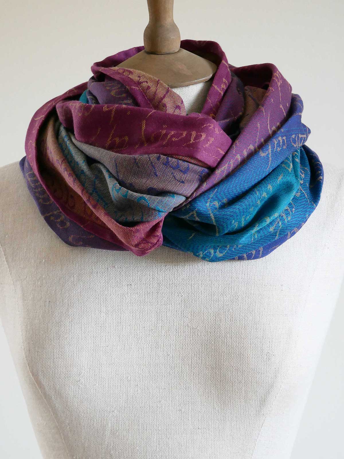 Multicolored scarf on a mannequin against a white background