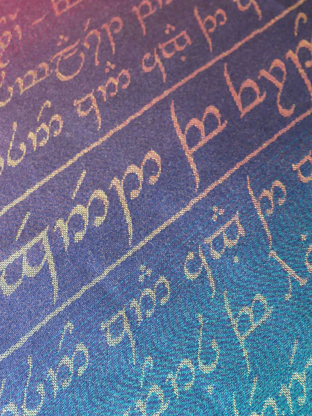 Text in a stylized script on a gradient blue and purple background