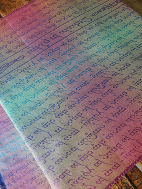Reverse of gradient fabric with printed text on a wooden surface