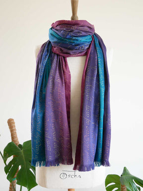Colorful Legend of Frodo Dreme Scarf with text on a mannequin against a white background
