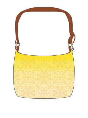 Mock up of a shoulder bag in yellow Lothlorien pattern fabric. 
