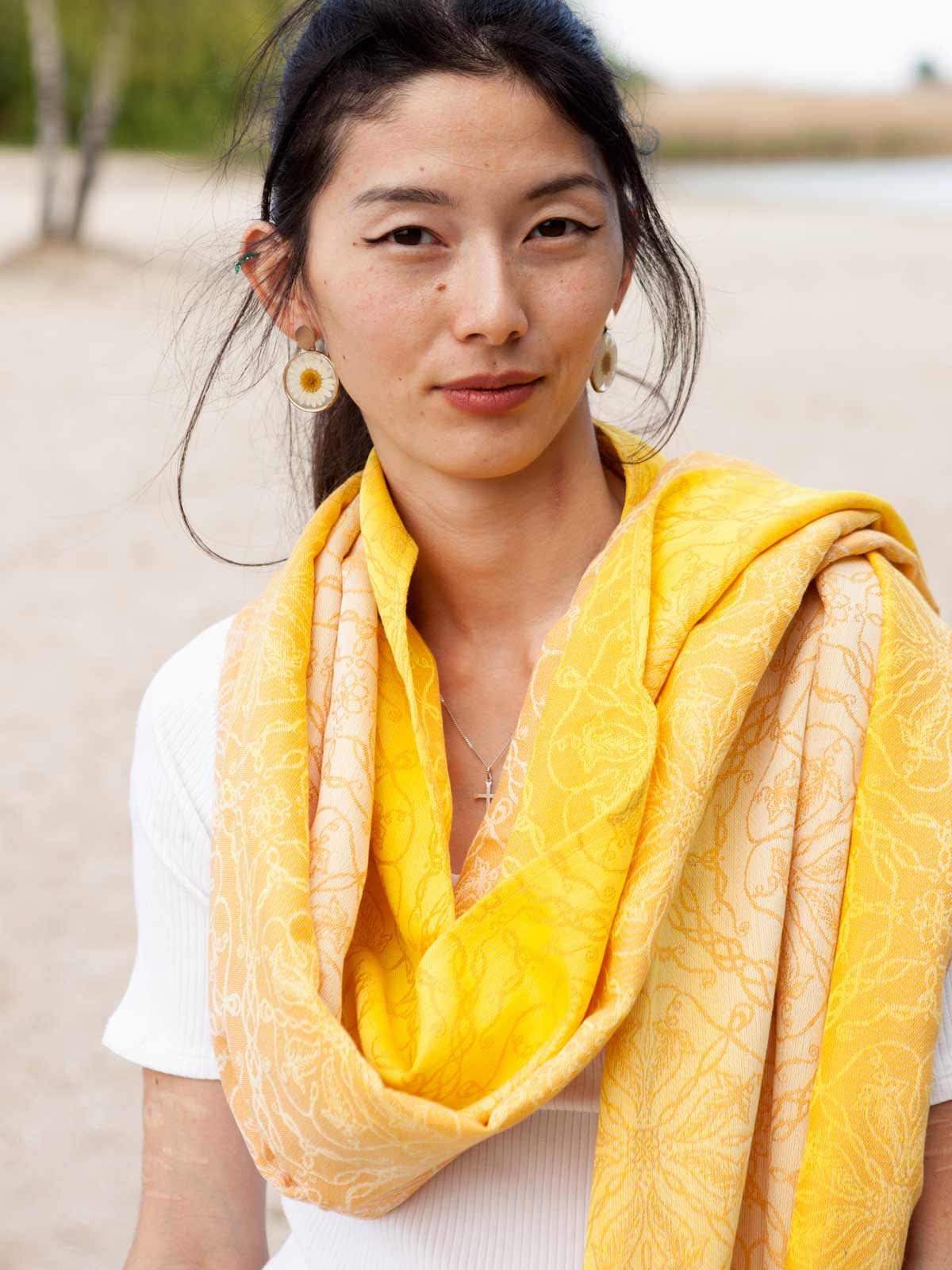 Model showing shawl draped like a scarf. 