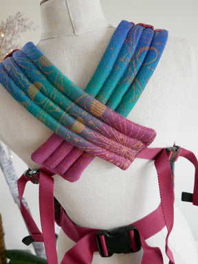 Colourful fabric straps on a mannequin with a white background