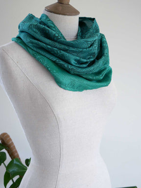 Green textured neckwear on a mannequin against a white background