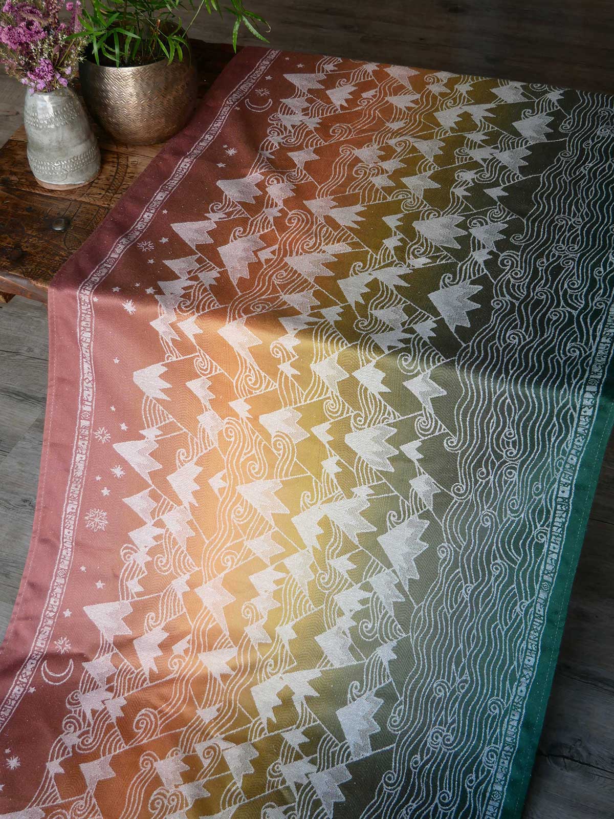 Misty Mountains Summit Ember fabric on a table