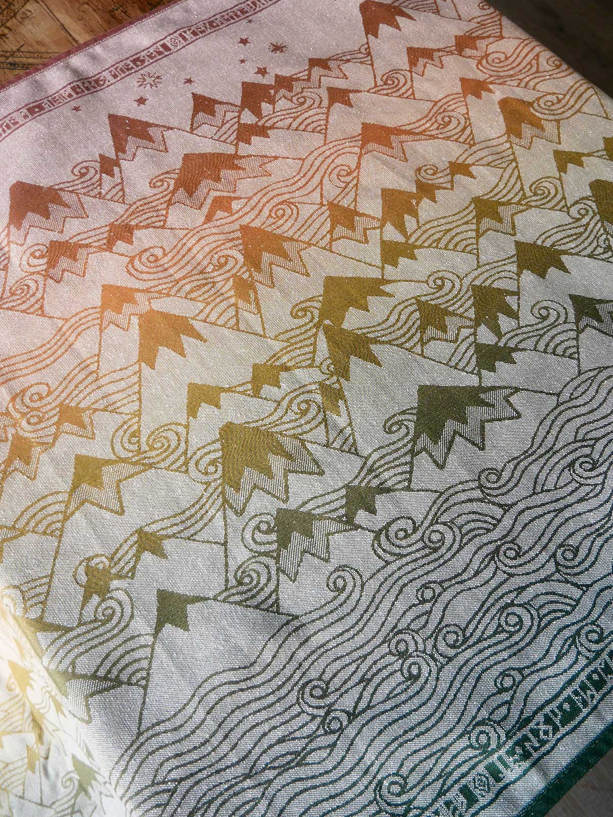 Textile with geometric pattern on a wooden surface