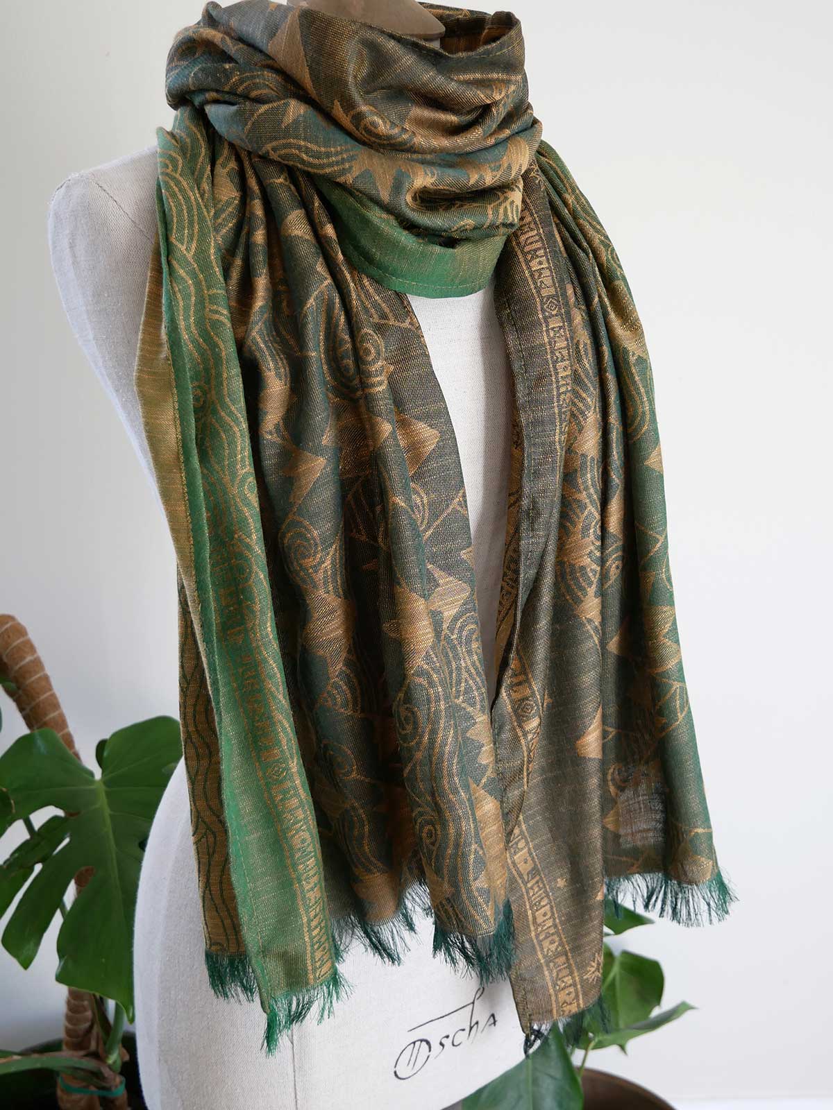 Green Misty Mountains patterned scarf on a mannequin with a white background