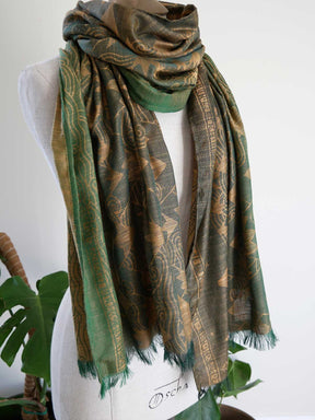 Green Misty Mountains patterned scarf on a mannequin with a white background