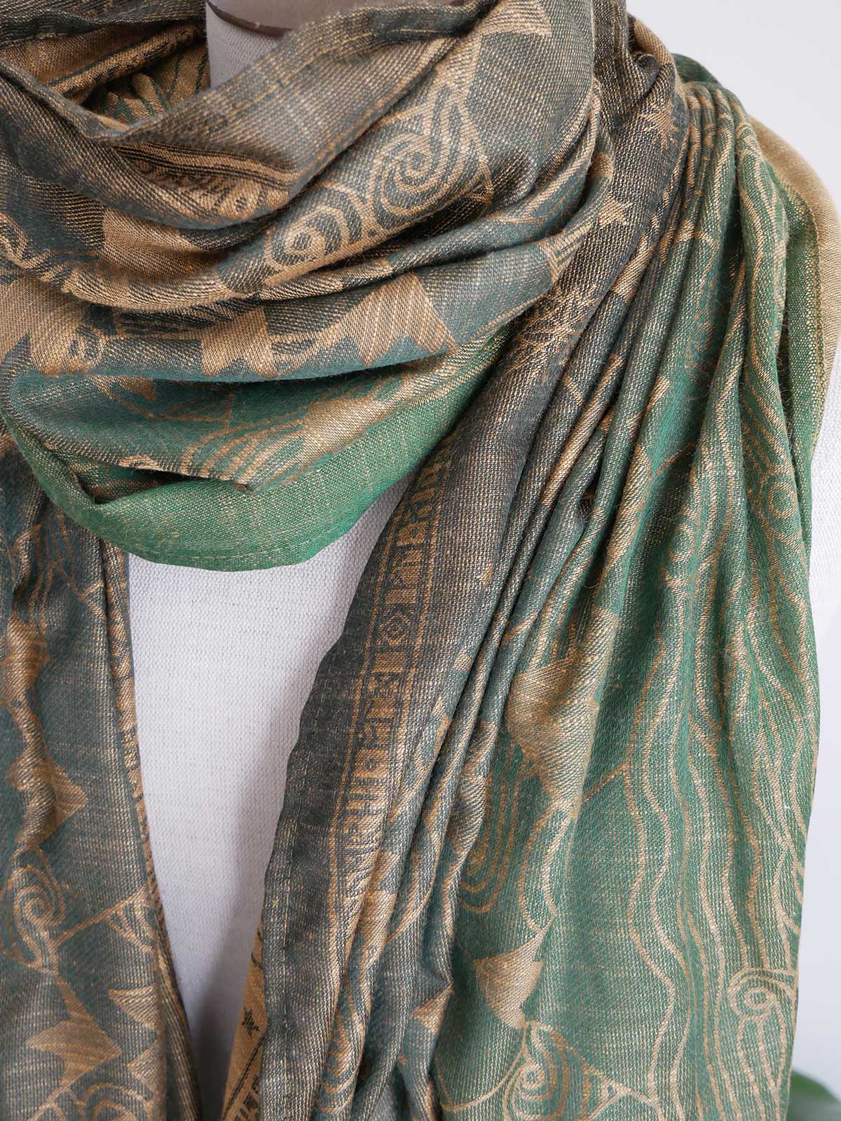 Green patterned scarf on a white background