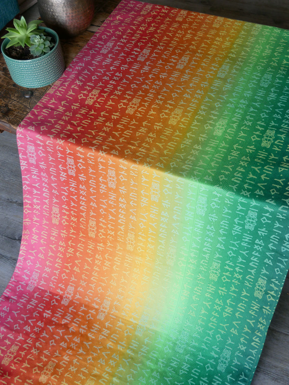 Gradient fabric with text pattern on a wooden surface