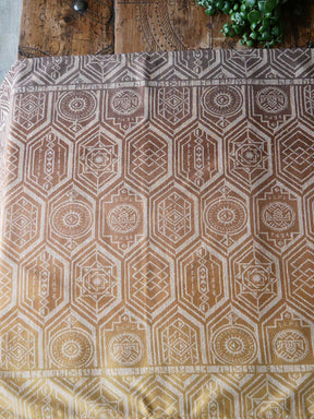 Textile with geometric pattern on a wooden surface