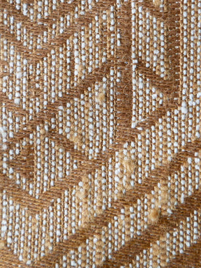 Close-up of a textured brown and beige fabric pattern