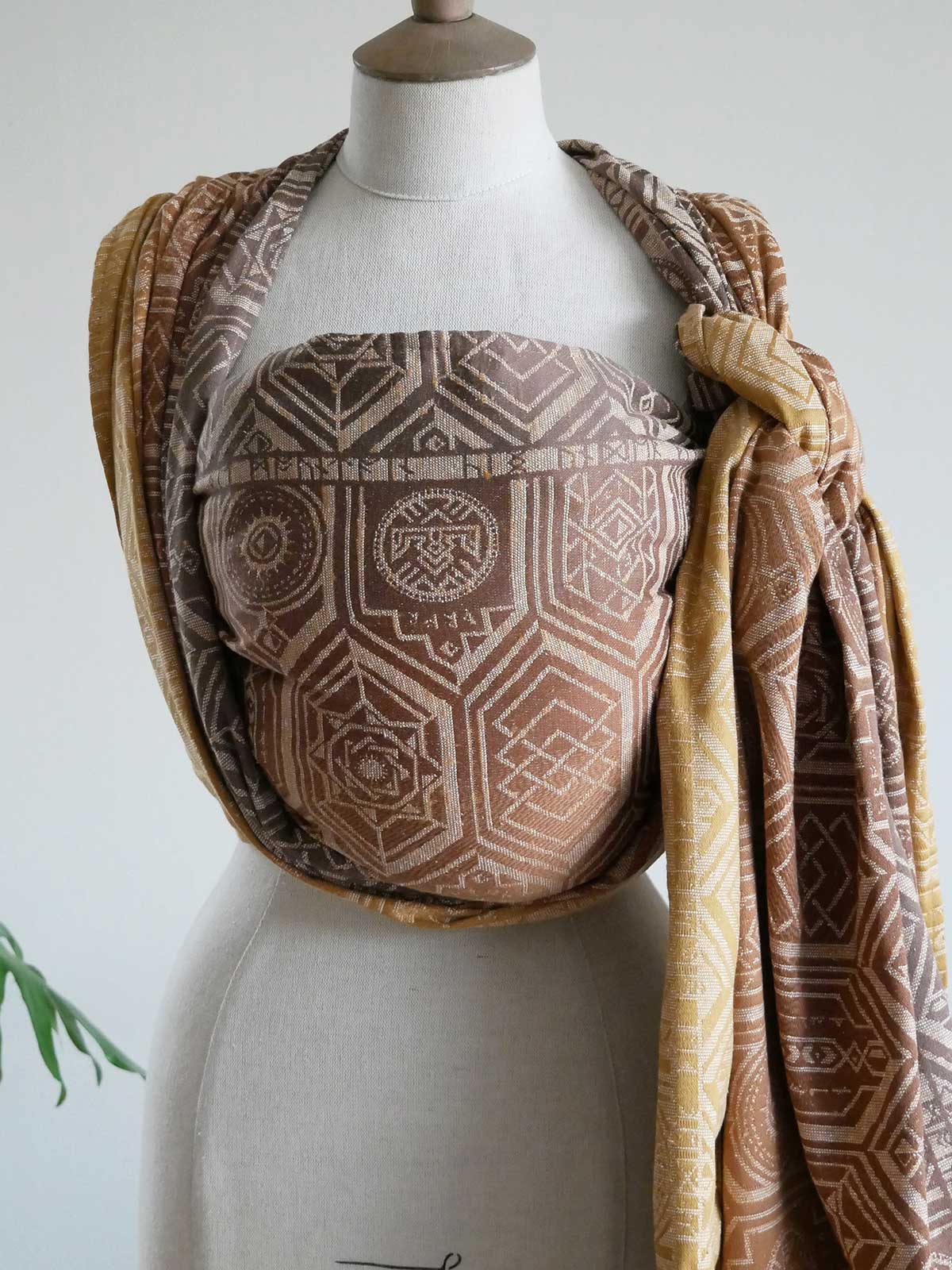 Oakenshield Dragon Hoard Baby Wrap with geometric pattern on a mannequin against a neutral background
