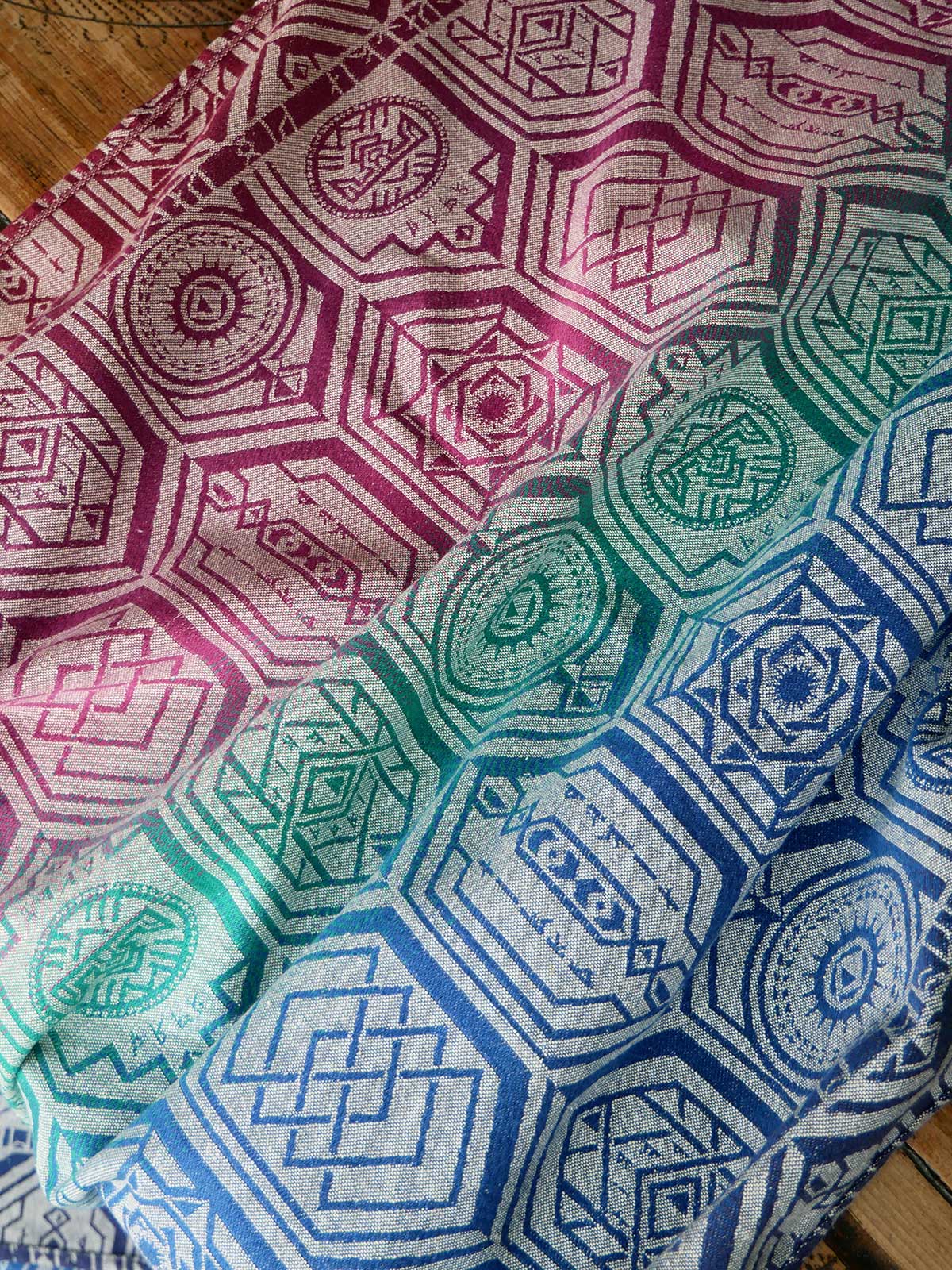 Reverse of a fabric with geometric pattern on a wooden table 