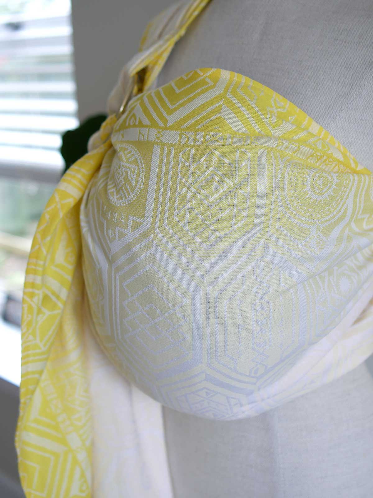 Yellow ring sling with geometric pattern on a mannequin