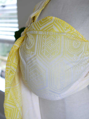 Yellow ring sling with geometric pattern on a mannequin