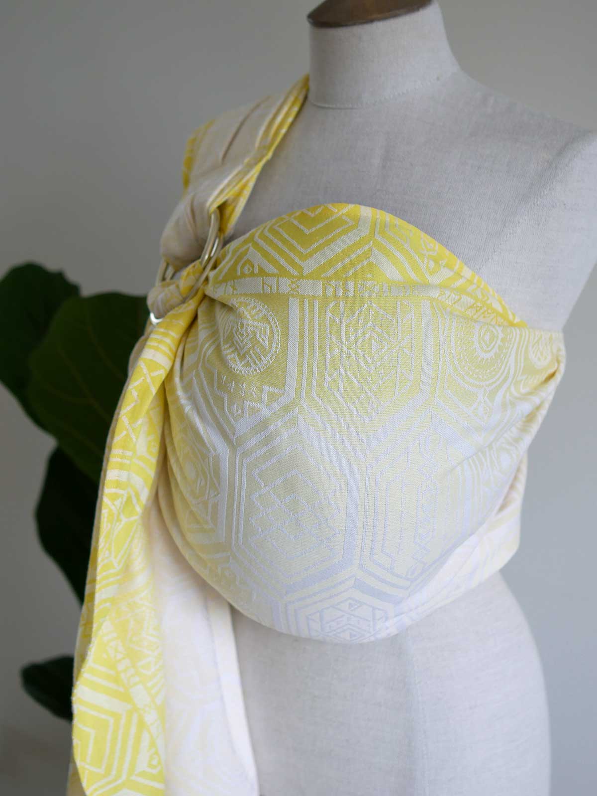 Yellow ring sling with geometric pattern on a mannequin