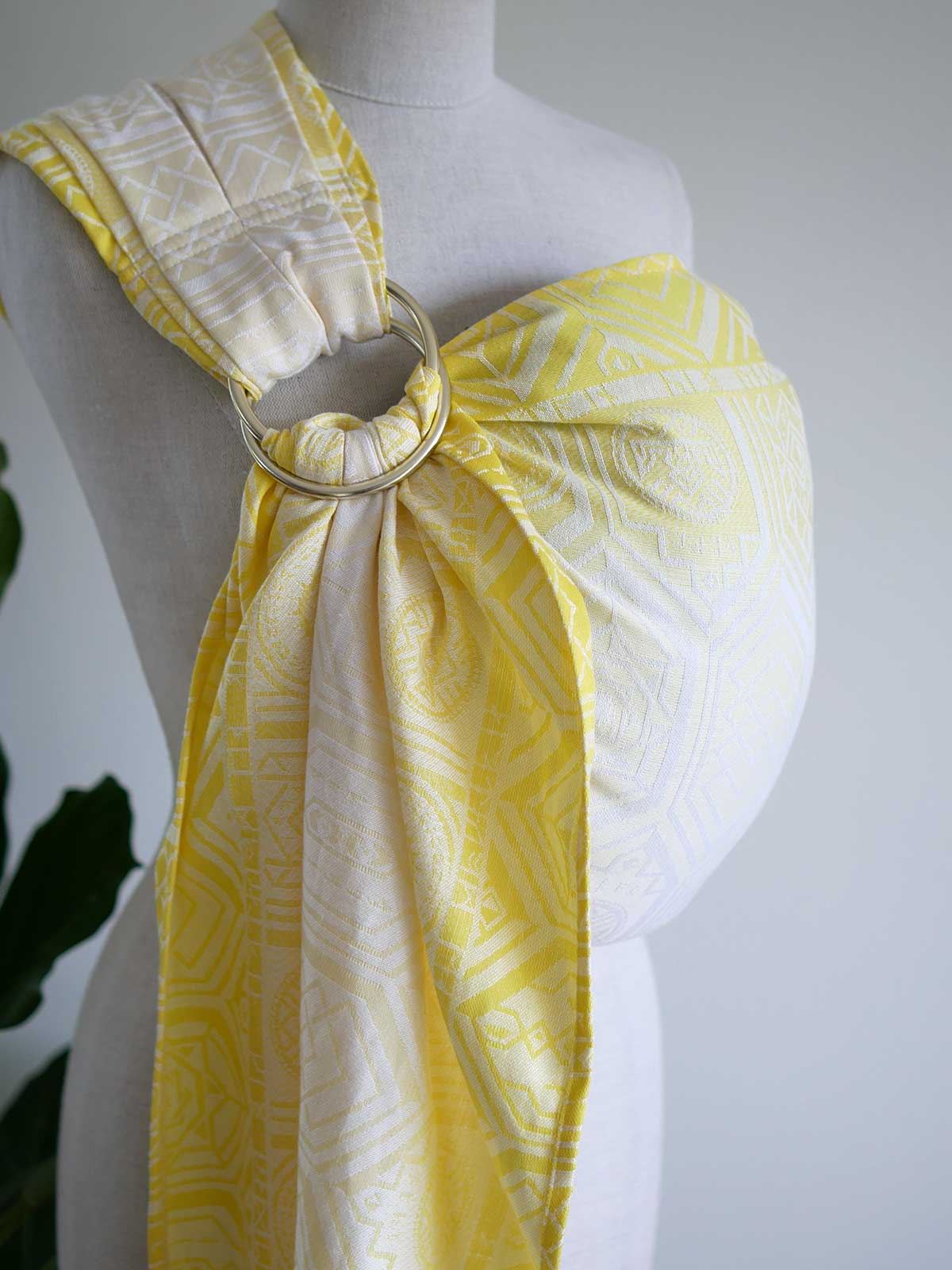 Yellow ring sling with geometric pattern on a mannequin