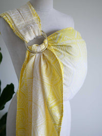Yellow ring sling with geometric pattern on a mannequin