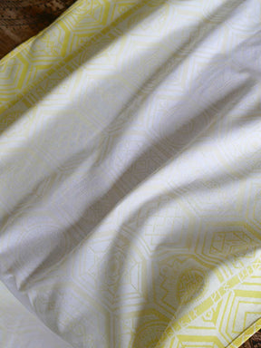 Yellow fabric with geometric pattern