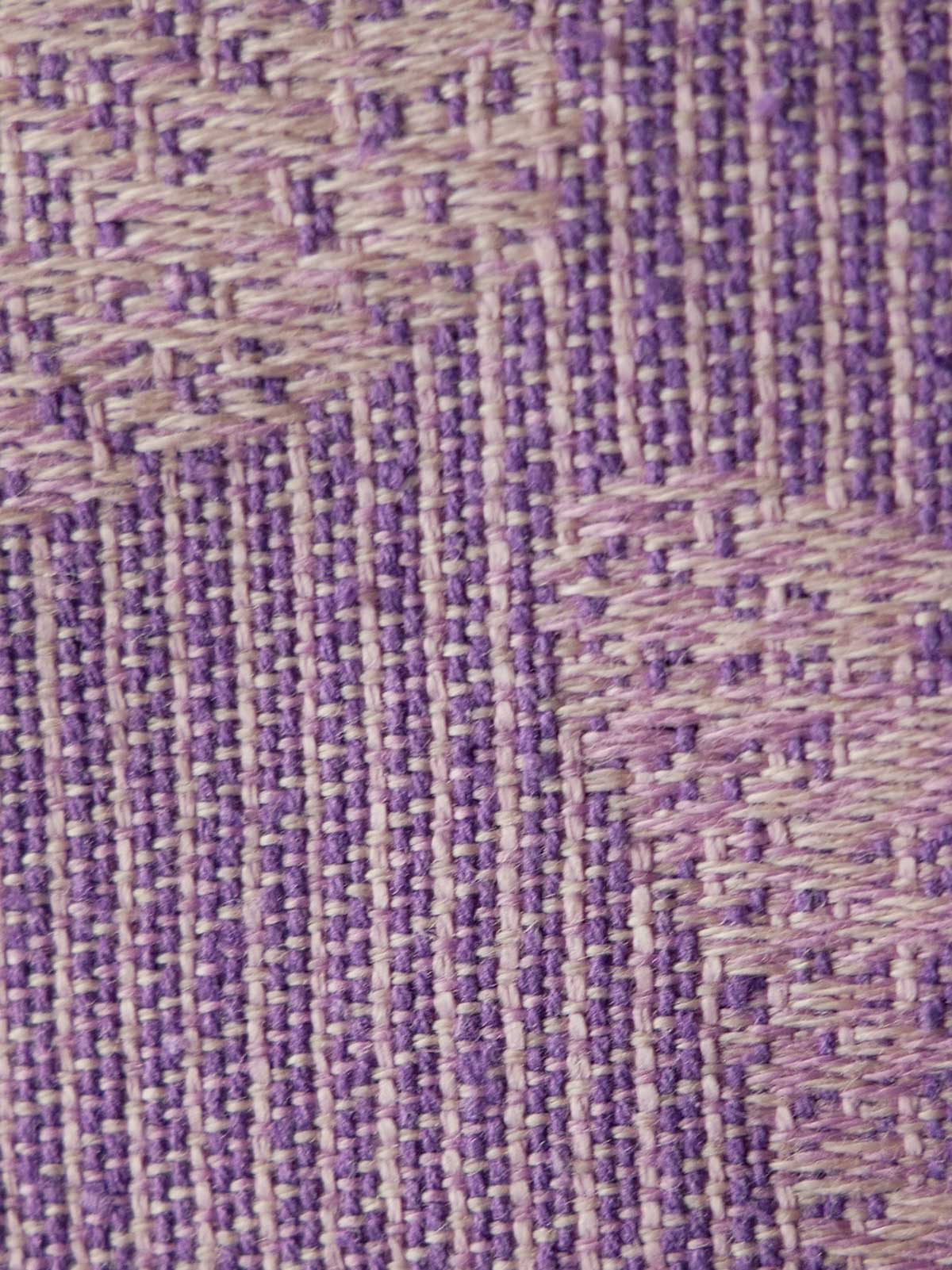 Close-up of a textured purple fabric pattern