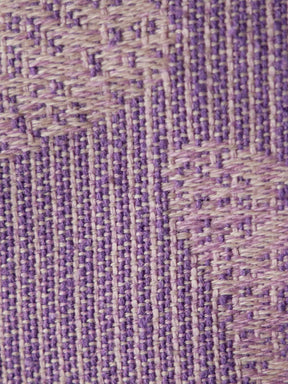 Close-up of a textured purple fabric pattern