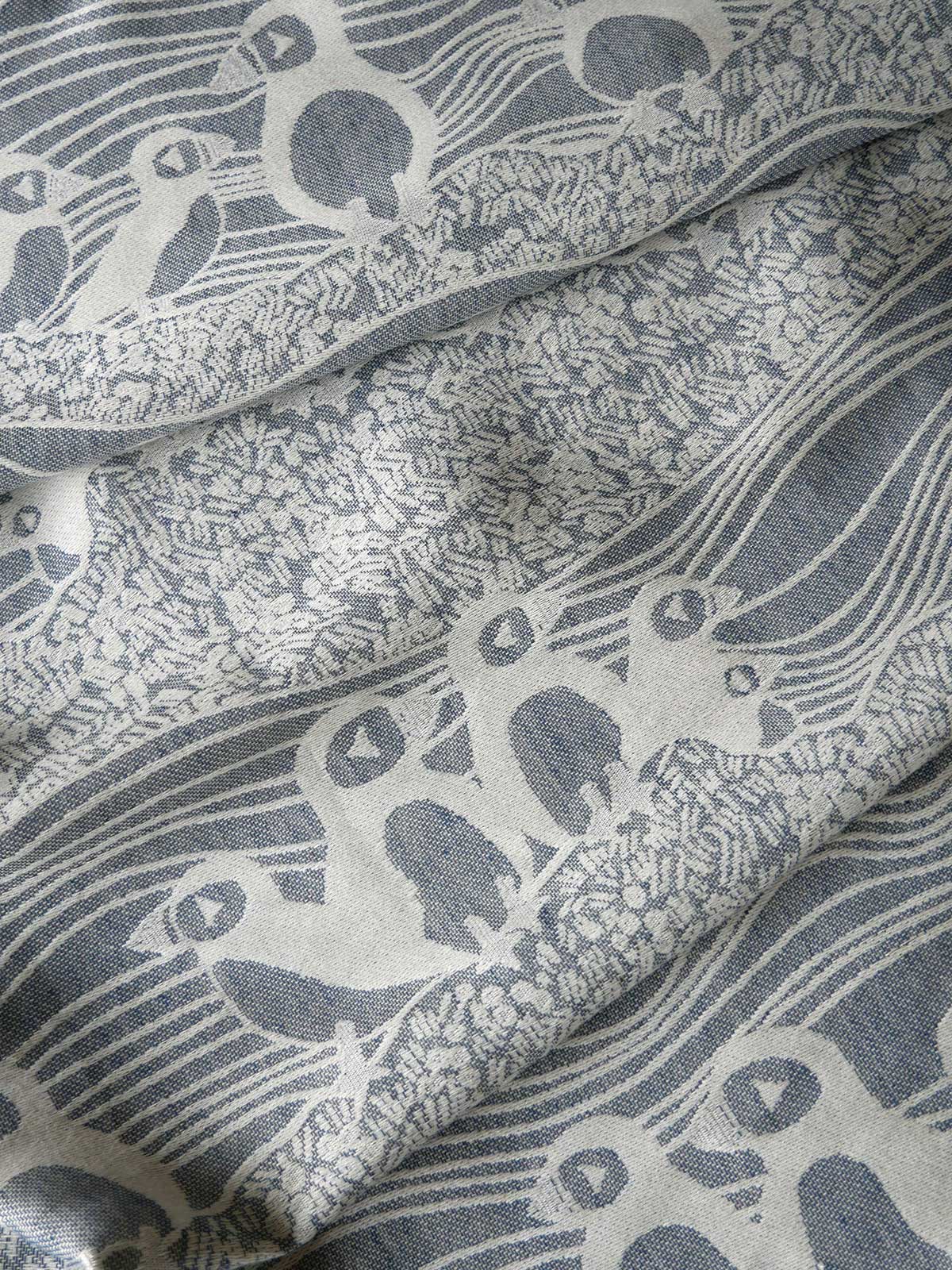 Close-up of patterned fabric with bird design