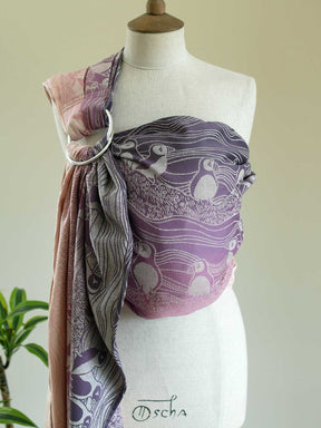 Front view of a pink and purple ring sling with puffin pattern on a mannequin