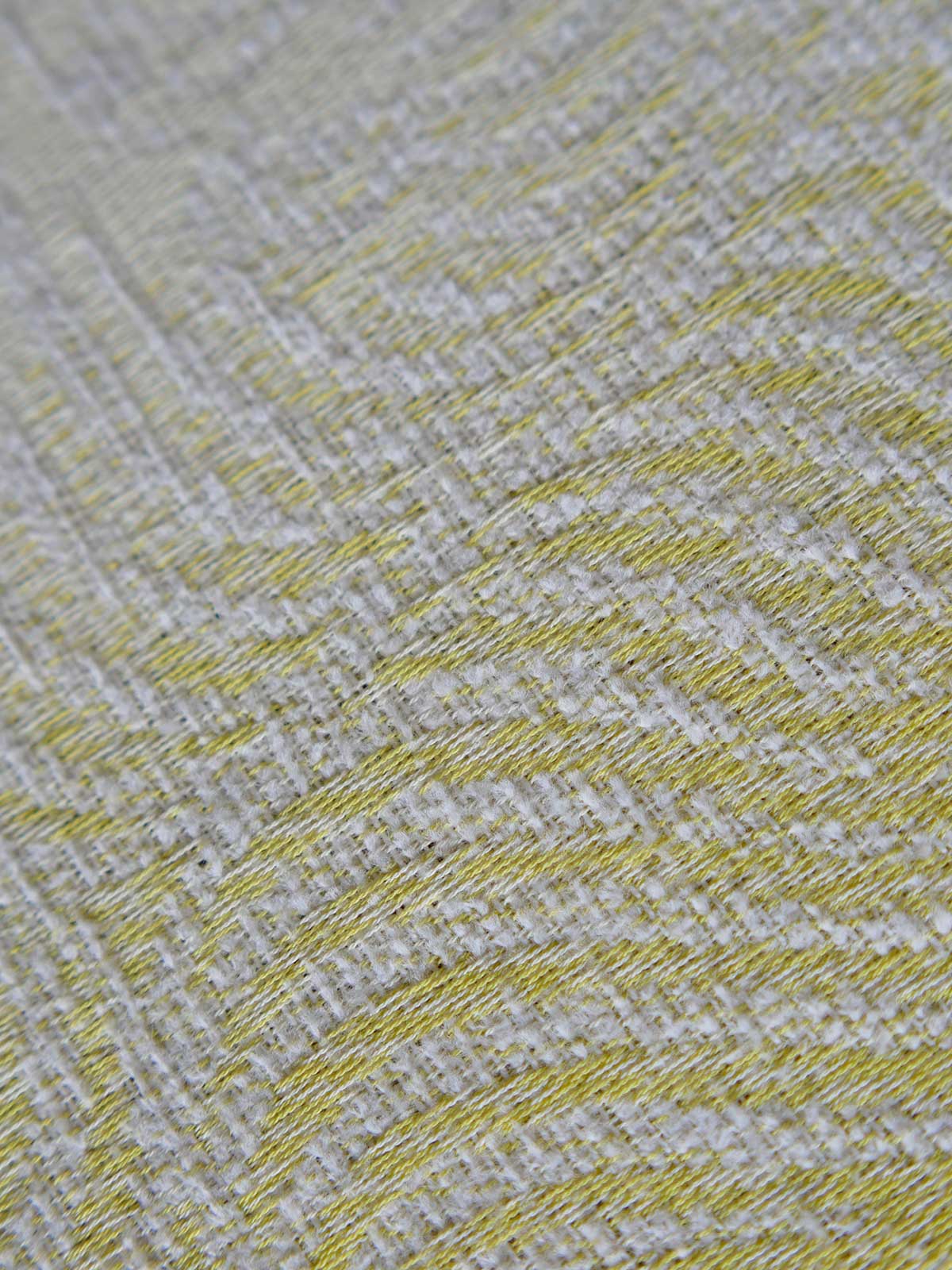 Close up of a yellow and white woven fabric