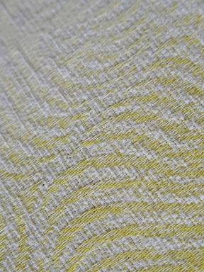 Close up of a yellow and white woven fabric