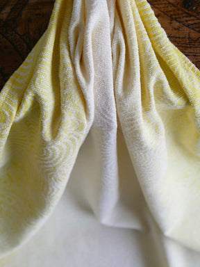 Close up of yellow and white woven fabric 