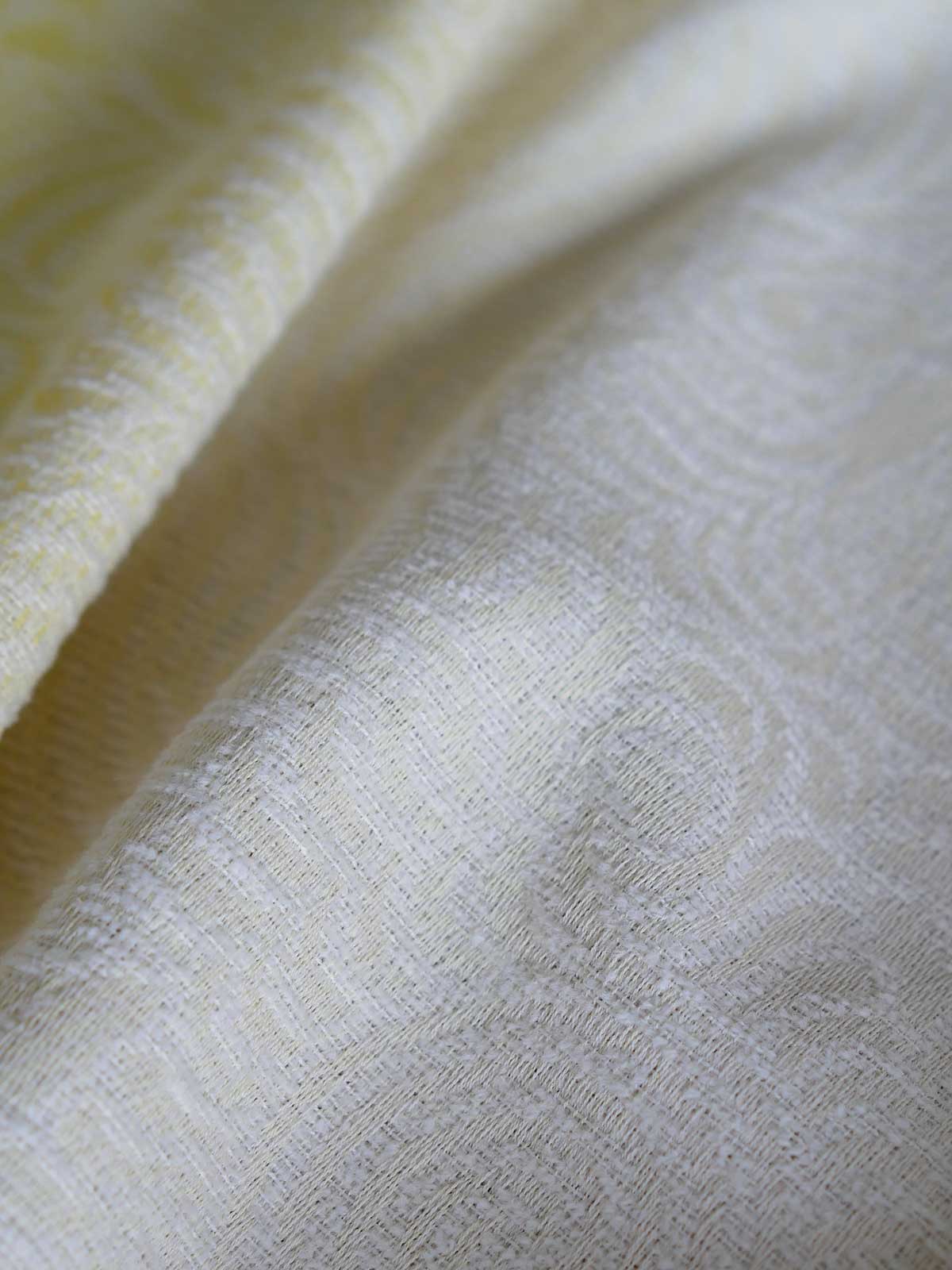 Close up of yellow and white woven fabric 