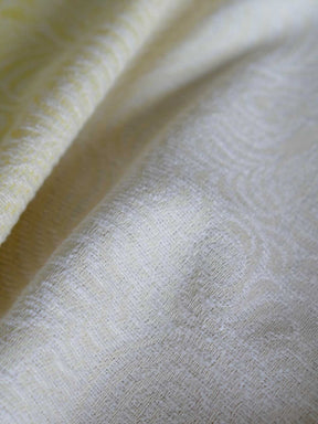 Close up of yellow and white woven fabric 