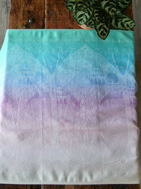 Textile with intricate patterns on a wooden surface