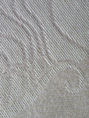 Close-up of a textured gray fabric with a subtle pattern