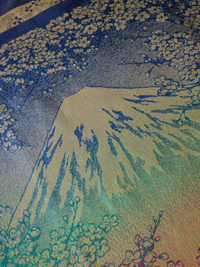 Decorative fabric with a mountain and floral pattern